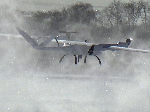 Songbird drone performing a low fly-by in the snow.